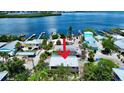 Aerial view of coastal home showcasing proximity to the water and neighborhood at 8416 Little Gasparilla Is, Placida, FL 33946