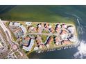 Aerial view of waterfront community with tennis courts and marina at 103 1St E St # 204, St Petersburg, FL 33715