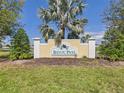 Community entrance sign to Bayou Pass neighborhood showcasing lush landscaping and the community name at 1405 Blossom Bayou Cir, Ruskin, FL 33570