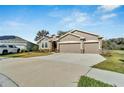 Beautiful single story home with a two car garage and attractive landscaping at 14069 Wineberry Dr, Dade City, FL 33525