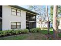 View of screened-in patio and lawn at 4655 46Th Street Ct # 101, Bradenton, FL 34210