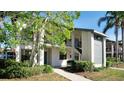Inviting two-story condo with well-maintained landscaping and a welcoming entrance at 4655 46Th Street Ct # 101, Bradenton, FL 34210