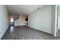 Spacious living room with gray plank tile flooring at 9141 Gulf Haven Dr, Parrish, FL 34219