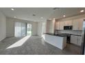 Open living room and kitchen with island at 9105 Gulf Haven Dr, Parrish, FL 34219