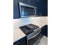 Stainless steel appliances and a gas cooktop with white herringbone backsplash at 184 Eagleston Ln, Lakewood Rch, FL 34240