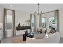 Bright living room with stylish furniture, decorative curtains, and ample natural light at 168 Eagleston Ln, Lakewood Ranch, FL 34240