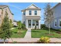 Beautiful two-story home with a green lawn and an inviting walkway to the front door at 9031 Duany Ln, Lakewood Ranch, FL 34240