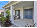 Inviting front porch with double doors and lush landscaping at 7458 Sea Manatee St, Parrish, FL 34219