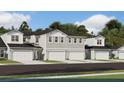 Townhouse exterior, gray and white, two-story, two-car garage at 9230 Gulf Haven Dr, Parrish, FL 34219