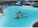 Large crystal lagoon with water park features and slides at 7454 Sea Manatee St, Parrish, FL 34219