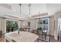 Modern kitchen with island, stainless steel appliances, and ample cabinet space at 9234 Gulf Haven Dr, Parrish, FL 34219