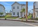 Charming two-story home with a well-manicured lawn and sidewalk in a residential area at 180 Eagleston Ln, Lakewood Ranch, FL 34240