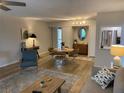 Open concept living and dining area with hardwood floors at 1714 69Th W Ave # B301, Bradenton, FL 34207