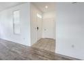 Bright foyer with tile flooring, white walls, and modern fixtures with views of the living room at 4007 Bangalow Palm Ct # 4007, Tampa, FL 33624