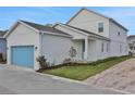 Stylish house with a side garage and a lovely, landscaped front yard at 196 Eagleston Ln, Lakewood Ranch, FL 34240