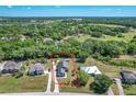 An aerial view of the property surrounded by lush greenery highlighting the property's boundaries at 3708 Alafia Creek St, Plant City, FL 33567