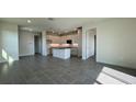 Bright open concept living room with a kitchen, tile flooring, and recessed lighting at 9270 Gulf Haven Dr, Parrish, FL 34219