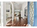 Spacious foyer with hardwood floors, arched doorways, and plenty of natural light at 17904 Singing Wood Pl, Lutz, FL 33548