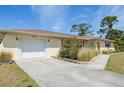 Cozy single-story home with an attached garage and a well-maintained lawn at 3067 Iverson St, Port Charlotte, FL 33952