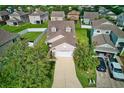 A picturesque aerial view showcases a well-maintained home with a lush green lawn and driveway at 4135 Rocky Fork Ter, Ellenton, FL 34222