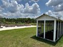 This property features a beautiful community garden with raised beds and a chicken coop at 17677 Nectar Flume Dr, Land O Lakes, FL 34637