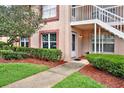 Well-maintained condo entrance with neat landscaping and brick window trim at 4804 Myrtle Oak Dr # 11, New Port Richey, FL 34653