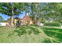 Two-story home with arched entry and a lush green lawn at 16601 W Course Dr, Tampa, FL 33624