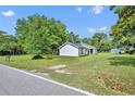 Lovely home featuring a spacious yard, mature trees, and a peaceful atmosphere at 13091 Old Crystal River Rd, Brooksville, FL 34601
