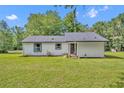 Beautiful home with a lush green lawn and charming curb appeal at 13091 Old Crystal River Rd, Brooksville, FL 34601