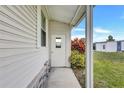 Welcoming home entrance with a covered walkway and colorful garden at 9790 66Th N St # 89, Pinellas Park, FL 33782