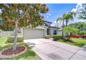 Well-maintained home with a spacious driveway and beautifully landscaped front yard at 107 Dakota Hill Dr, Seffner, FL 33584
