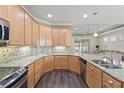 Large kitchen with granite counters and stainless steel appliances at 2429 Nottingham Greens Dr # 118, Sun City Center, FL 33573