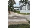 Modern architectural home with a waterfront view and tropical landscaping at 1612 Pocatello St, Sarasota, FL 34231