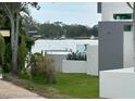 Waterfront home showcasing lush green landscaping along a tranquil river at 1612 Pocatello St, Sarasota, FL 34231