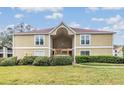 Inviting two-story condominium building with well-maintained landscaping and a charming facade at 9481 Highland Oak Dr # 715, Tampa, FL 33647