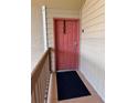 A welcoming front door with a black doormat outside unit 715 at 9481 Highland Oak Dr # 715, Tampa, FL 33647