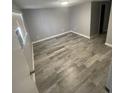 Neutral bedroom with hard floors and a window offering natural light at 6019 W Fern St, Tampa, FL 33634