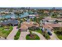 Beautiful single Gathering home with a well-manicured lawn, circular driveway, and mature landscaping at 1120 81St S St, St Petersburg, FL 33707