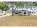 Charming single-story home with stone accents and a well-manicured lawn at 2204 Krista Ln, Brandon, FL 33511