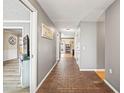 Inviting foyer with brick floor and neutral-toned walls, leading to living areas at 2204 Krista Ln, Brandon, FL 33511