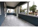 Inviting screened front porch with tile floors, perfect for enjoying the outdoors at 5117 16Th Ave, Gulfport, FL 33707