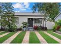 Charming home featuring a well-manicured lawn and inviting front porch at 4444 5Th S Ave, St Petersburg, FL 33711