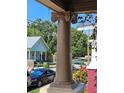 Close up of an ornate column supporting the porch roof showing classical architectural details and design elements at 917 E 15Th Ave, Tampa, FL 33605
