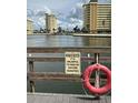 Picturesque waterfront view with multi-story condominiums, and a warning to respect the local manatee population at 4750 Cove Cir # 502, St Petersburg, FL 33708