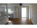 Eat in Kitchen featuring wood flooring and sliding glass doors at 3536 Harbor Blvd, Port Charlotte, FL 33952