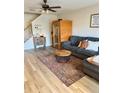 Cozy living room with wood-look flooring, an infared sauna, and stylish furniture at 3433 Dragon View Ct, Valrico, FL 33594