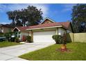 One-story house featuring a white garage and neatly manicured lawn at 7801 Glascow Dr, New Port Richey, FL 34653