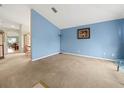 Spacious living room with light blue walls and carpeted floors at 10507 Goldwater Ln, Riverview, FL 33569