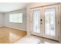 Bright entryway with light flooring and double doors at 8613 Beth Ct, Odessa, FL 33556