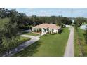 Expansive aerial view of home on large lot featuring well-manicured lawn and long driveway at 2638 E Knights Griffin Rd Rd, Plant City, FL 33565